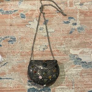 Unique small metal purse with pretty stones.